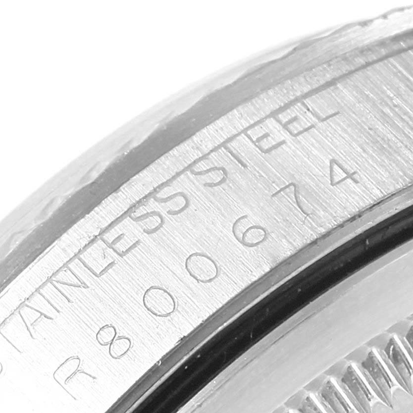 This is a close-up of the bezel and part of the case, showing the engraving 
STAINLESS STEEL
, of a Rolex Datejust 16234 Stainless Steel White Dial 16234 Stainless Steel White Dial watch.