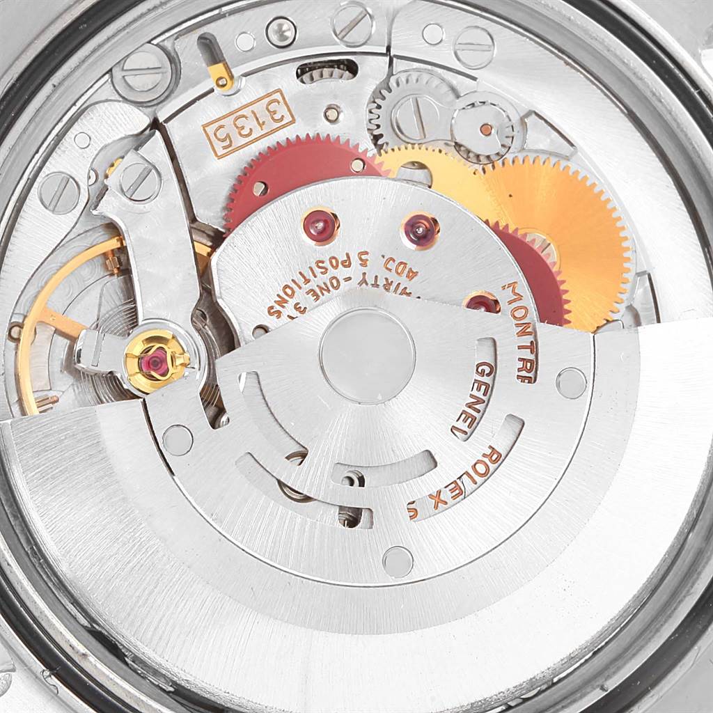 This is a close-up view of the internal movement components of a Rolex Datejust 16234 Stainless Steel White Dial 16234 Stainless Steel White Dial watch, showing gears and the rotor.