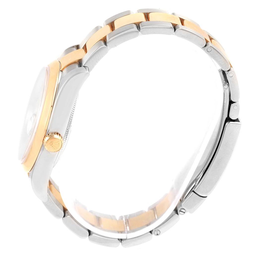 The image shows a side view of a Rolex Datejust 116203 Stainless Steel Mother of Pearl Dial 116203 Stainless Steel Mother of Pearl Dial watch, highlighting its case and two-tone bracelet.