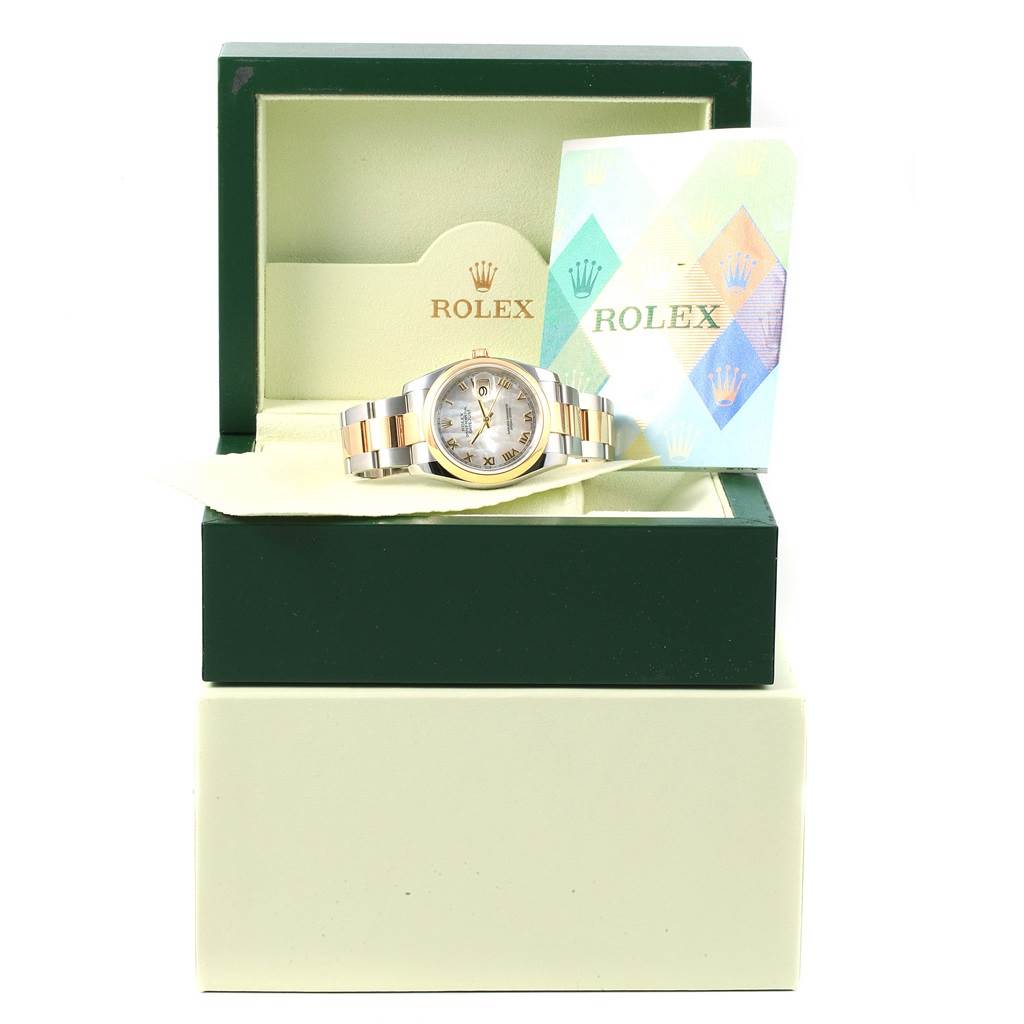 The Rolex Datejust 116203 Stainless Steel Mother of Pearl Dial 116203 Stainless Steel Mother of Pearl Dial watch is shown in an open box with its warranty card displayed beside it.