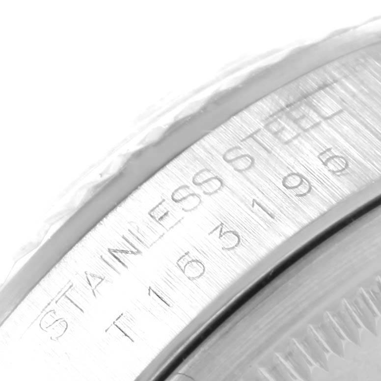 This close-up image shows the engraved stainless steel material and serial number on the side of the Rolex Datejust 16234 Men's Stainless Steel White Dial 16234 Men's Stainless Steel White Dial watch case.
