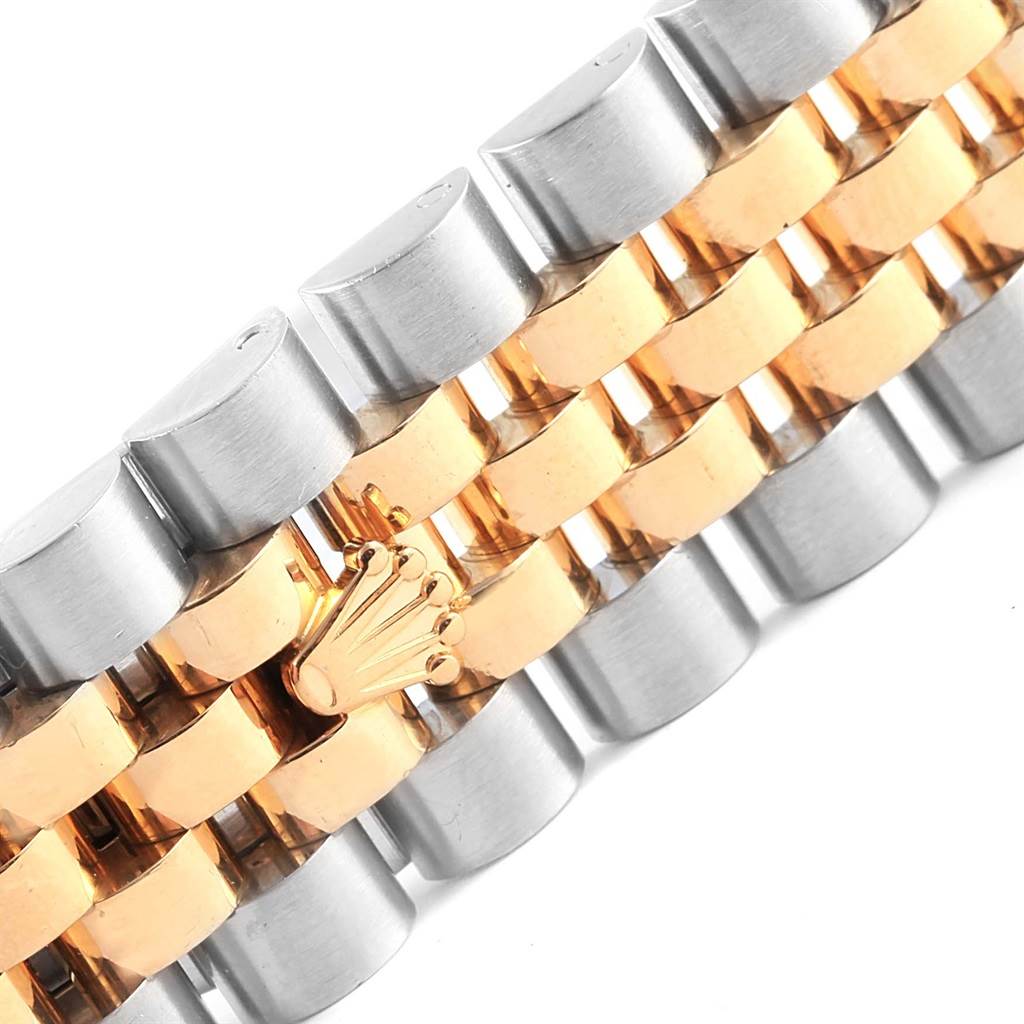 The image shows a close-up of the bracelet of a Rolex Datejust 116233 Stainless Steel Champagne Dial 116233 Stainless Steel Champagne Dial watch, highlighting its two-tone metal links and the Rolex crown logo.