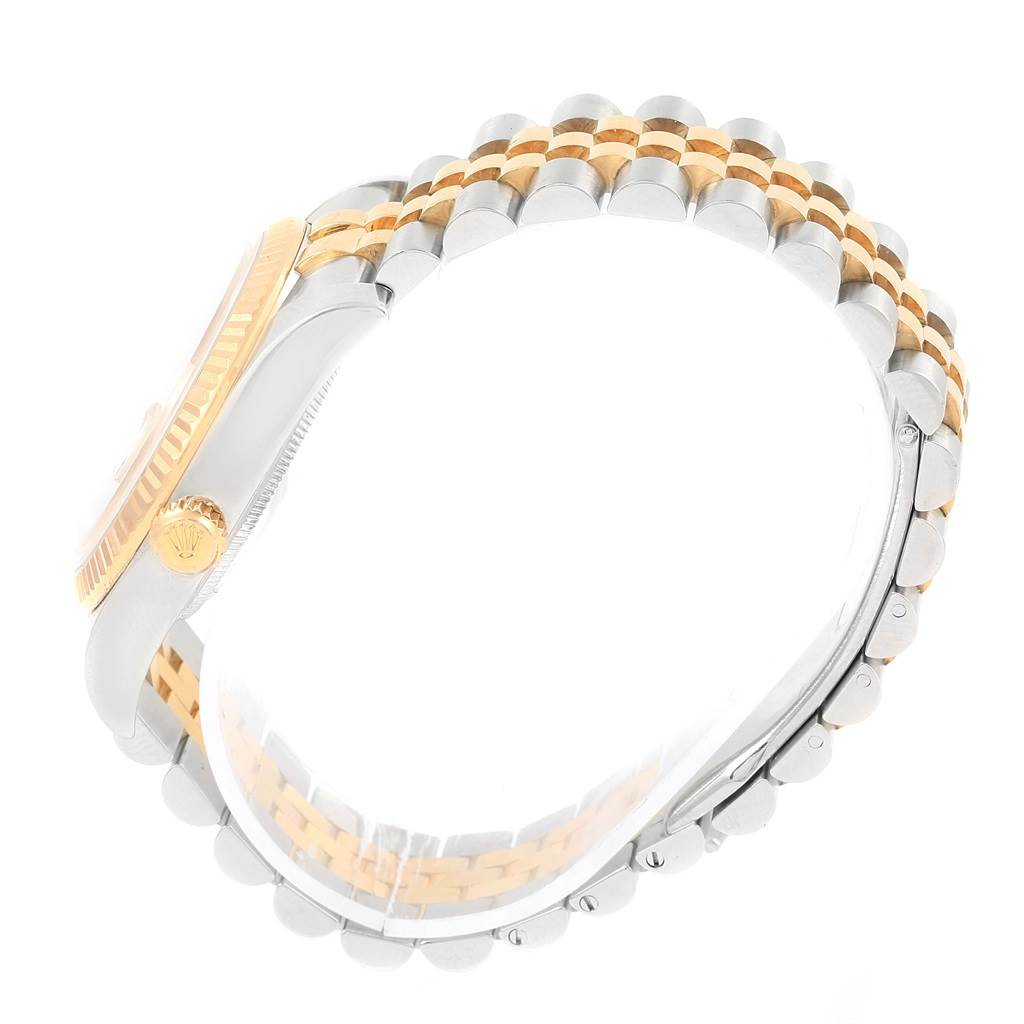 The image shows a side view of a Rolex Datejust 116233 Stainless Steel Champagne Dial 116233 Stainless Steel Champagne Dial's case, crown, and two-tone Jubilee bracelet.