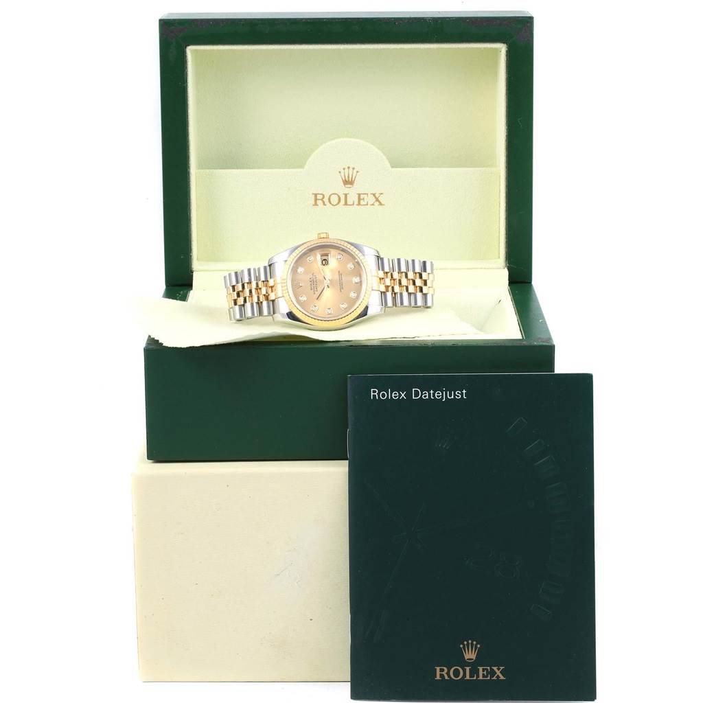 The Rolex Datejust 116233 Stainless Steel Champagne Dial 116233 Stainless Steel Champagne Dial watch is displayed inside its open box with a booklet in front.