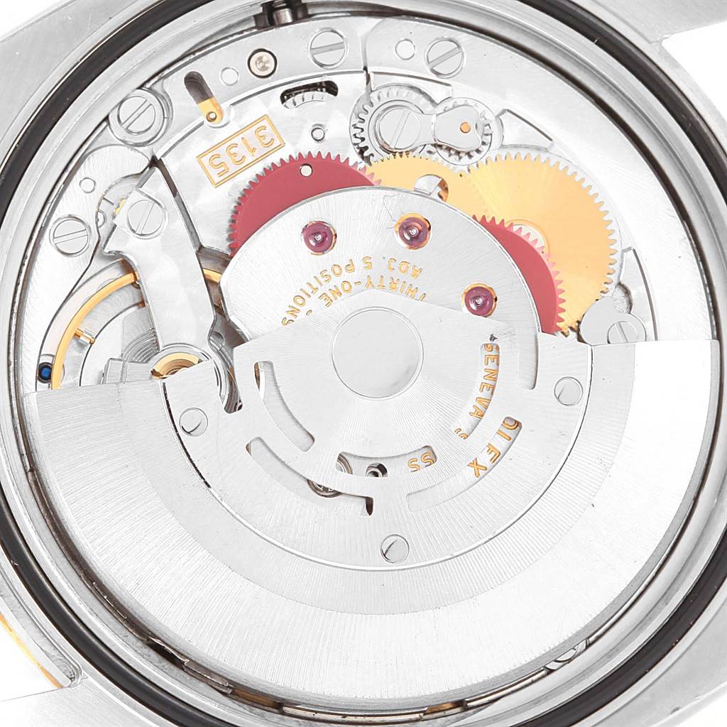This image shows an up-close view of the movement and internal components of a Rolex Datejust 116233 Stainless Steel Champagne Dial 116233 Stainless Steel Champagne Dial watch.