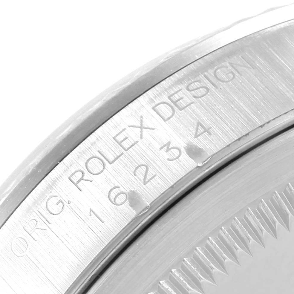 This image shows a close-up of the side and back case of a Rolex Datejust 16234 Men's Stainless Steel White Dial 16234 Men's Stainless Steel White Dial watch, highlighting the "ROLEX DESIGN" engraving.