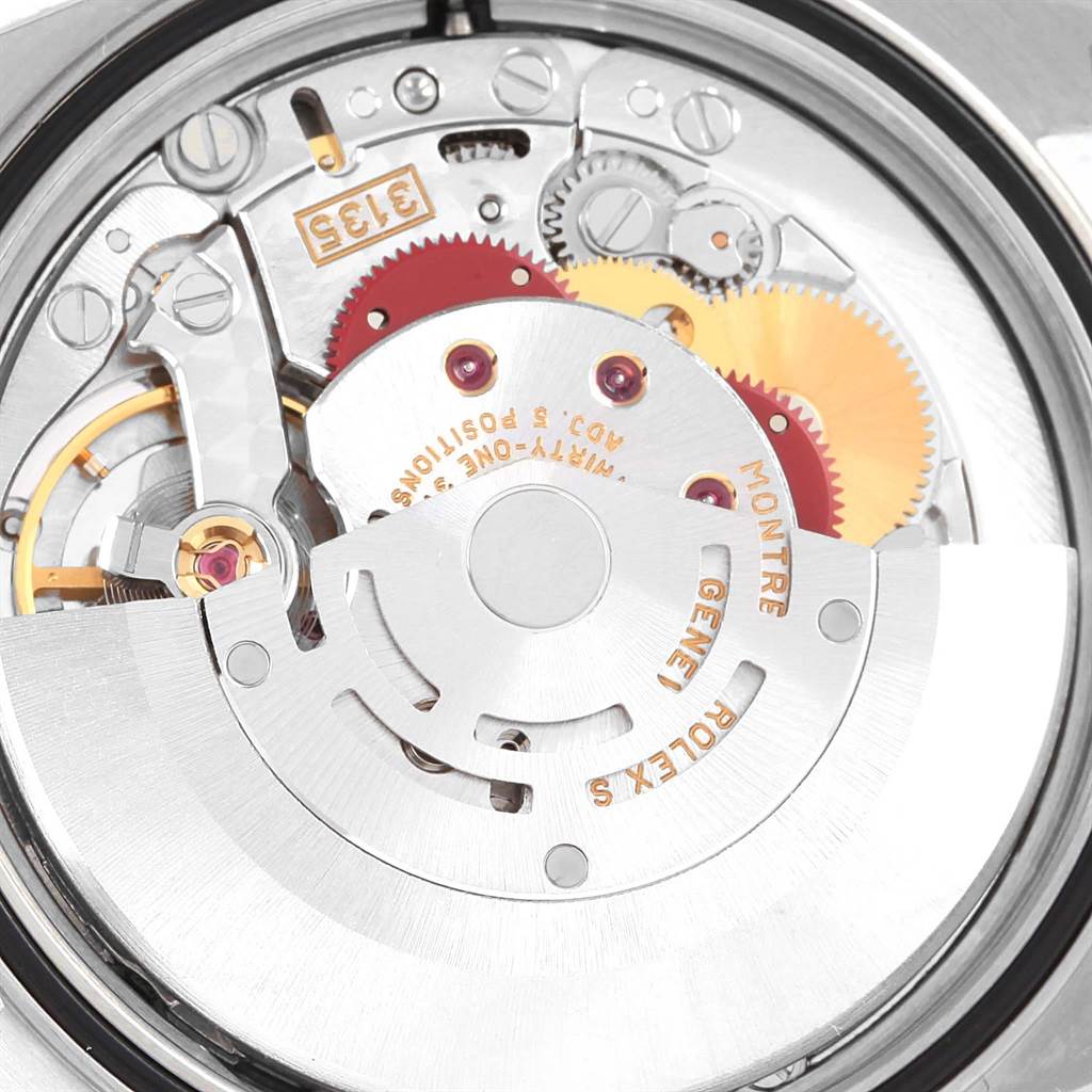 The image shows a close-up of the Rolex Datejust 16233 Steel and Gold (two tone) Champagne Dial 16233 Steel and Gold (two tone) Champagne Dial watch's internal movement mechanism from the back.