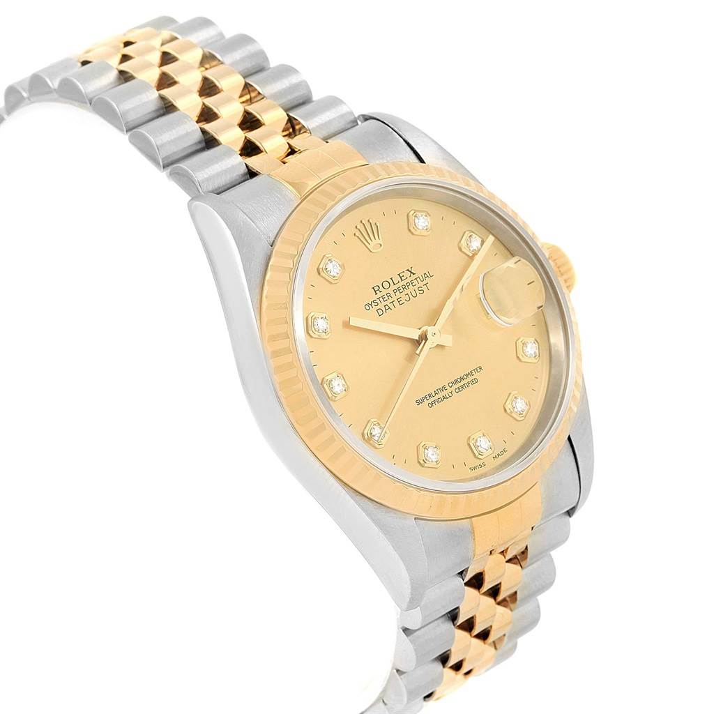 This image shows a side-angle view of the Rolex Datejust 16233 Steel and Gold (two tone) Champagne Dial 16233 Steel and Gold (two tone) Champagne Dial watch, displaying the dial, bezel, crown, and two-tone bracelet.