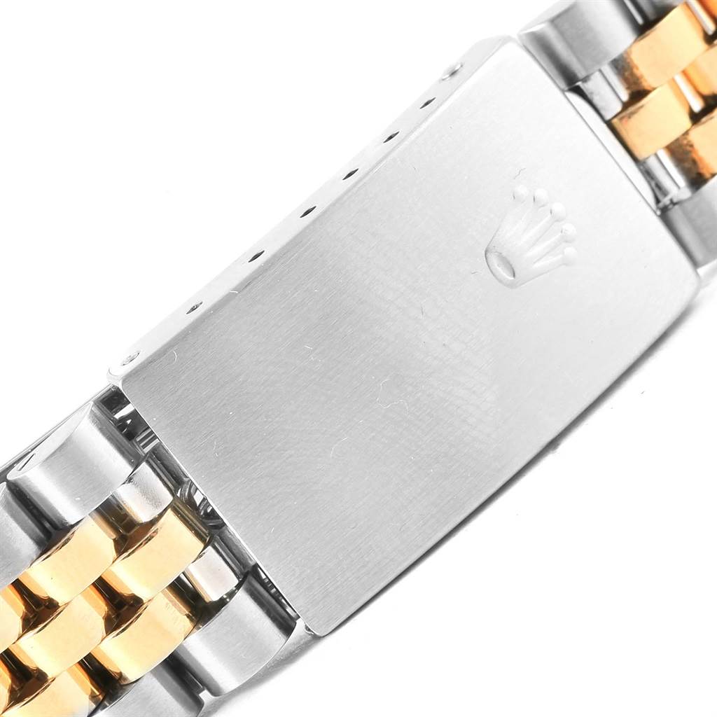 This image shows a close-up of the clasp and part of the bracelet of a Rolex Datejust 16233 Steel and Gold (two tone) Champagne Dial 16233 Steel and Gold (two tone) Champagne Dial watch.