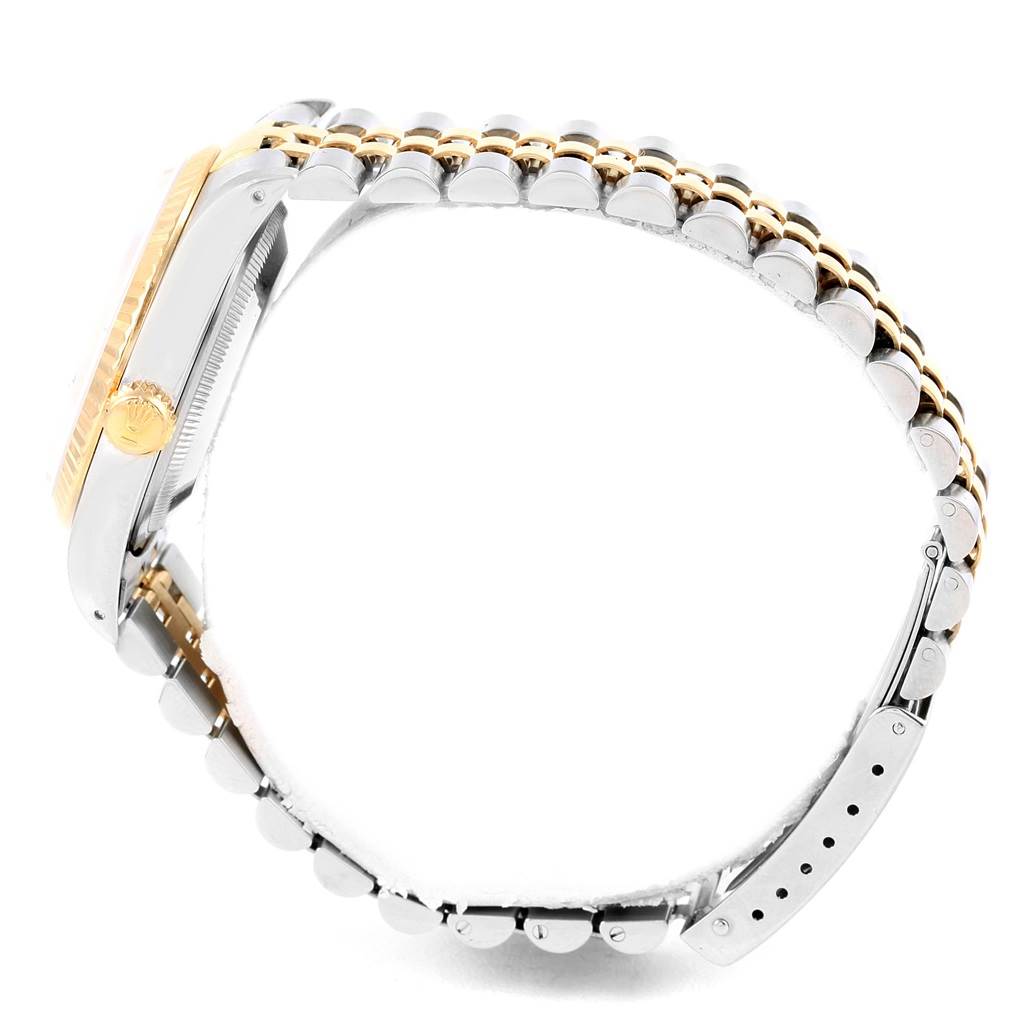 The image shows a side view of a Rolex Datejust 16233 Men's Steel and Gold (two tone) Silver Dial 16233 Men's Steel and Gold (two tone) Silver Dial watch, highlighting the bracelet and the crown on the case.