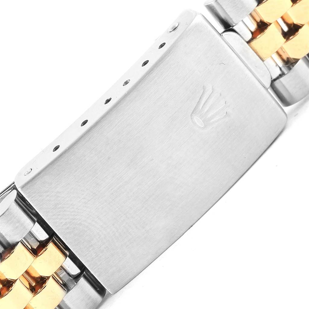 This image shows a close-up of the clasp and bracelet of a Rolex Datejust 16233 Men's Steel and Gold (two tone) Silver Dial 16233 Men's Steel and Gold (two tone) Silver Dial watch.