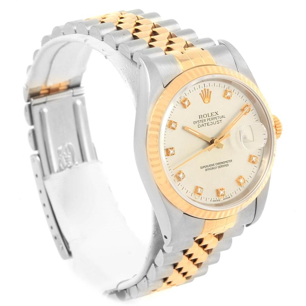 The Rolex Datejust 16233 Men's Steel and Gold (two tone) Silver Dial 16233 Men's Steel and Gold (two tone) Silver Dial watch is shown at an angle highlighting its two-tone bracelet, fluted bezel, and diamond hour markers.