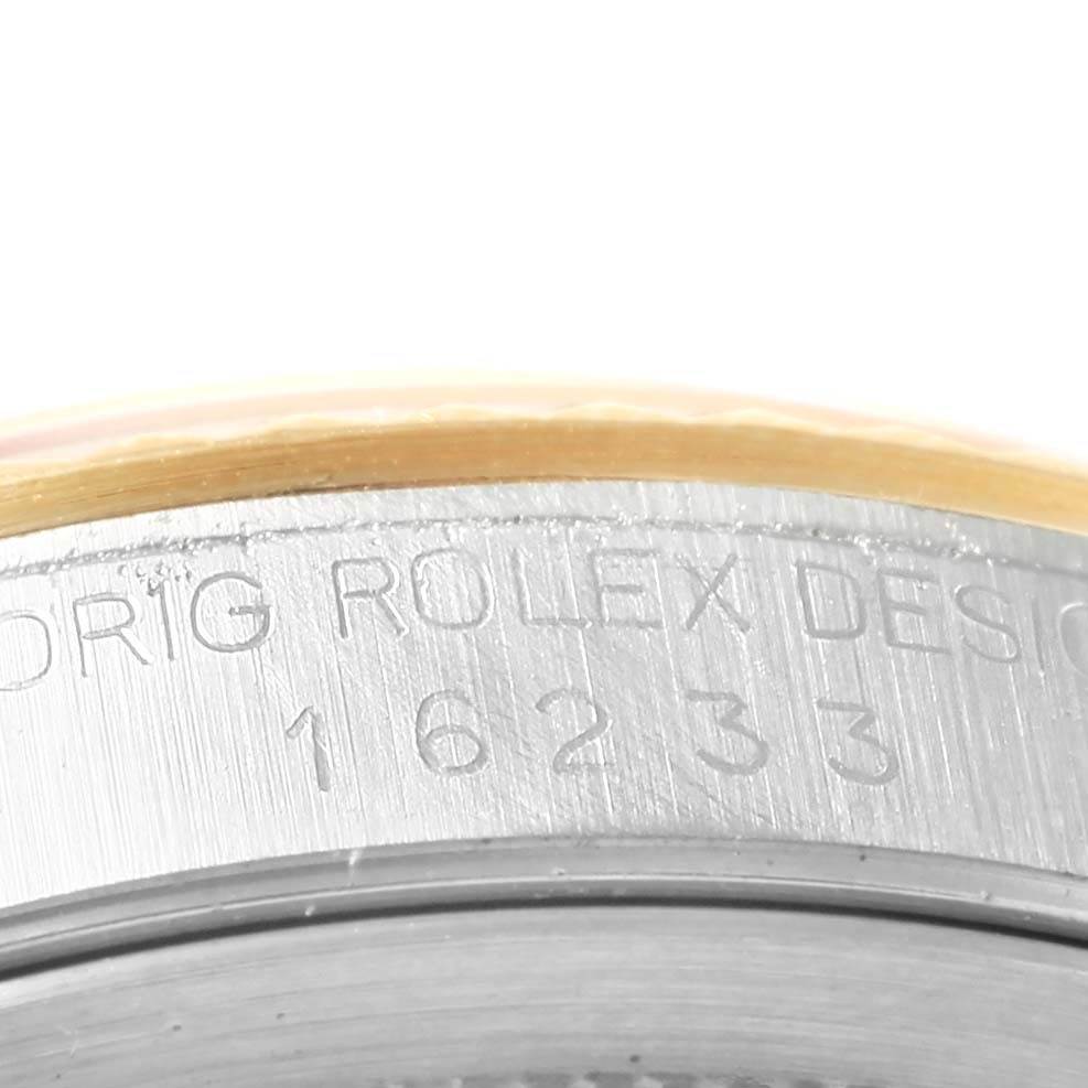 This close-up image shows the model number engraving on the case of a Rolex Datejust 16233 Men's Steel and Gold (two tone) Silver Dial 16233 Men's Steel and Gold (two tone) Silver Dial watch.