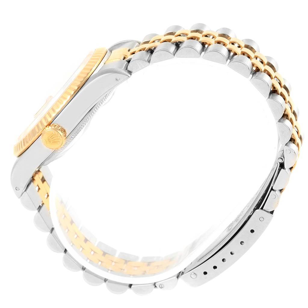 This image shows a side view of a Rolex Datejust 16233 Steel and Gold (two tone) Champagne Dial 16233 Steel and Gold (two tone) Champagne Dial watch, highlighting the case, crown, and two-tone bracelet.