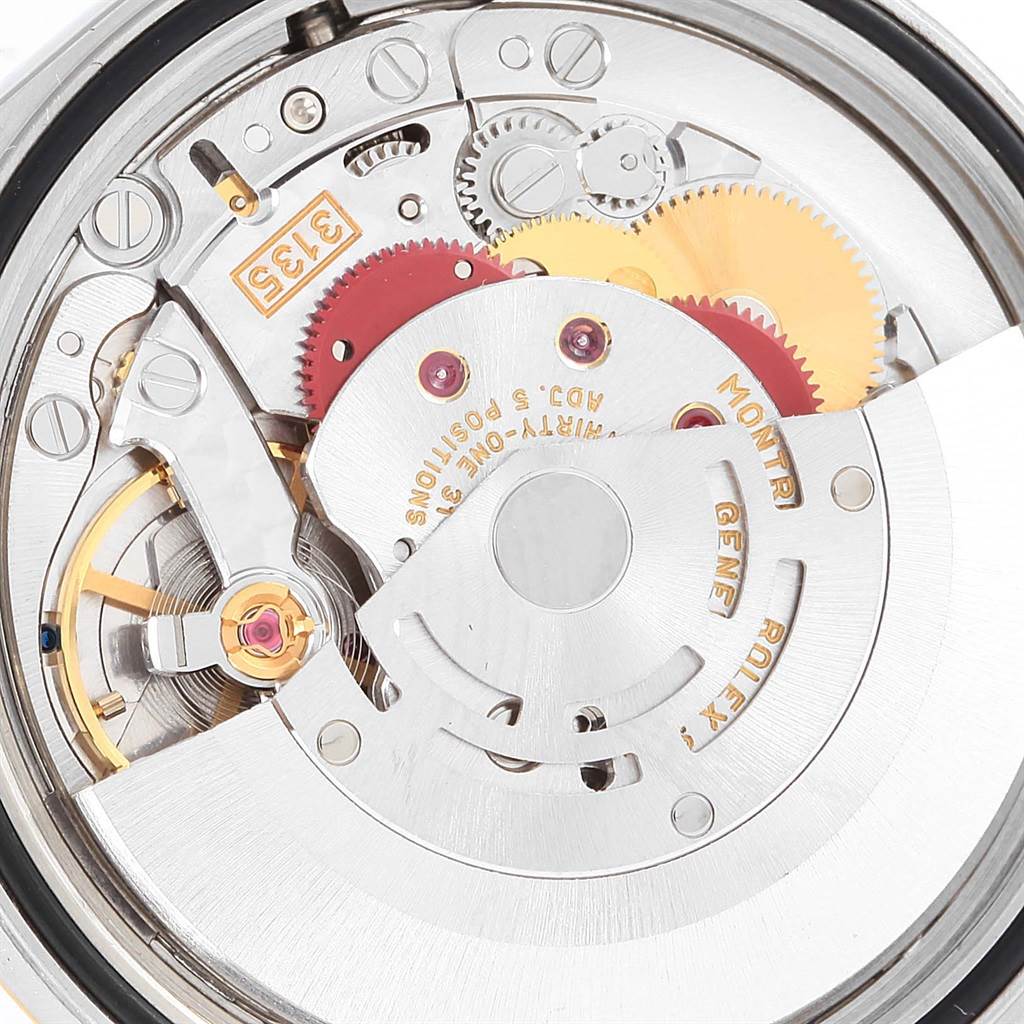 This is an up-close view of the Rolex Datejust 16233 Steel and Gold (two tone) Champagne Dial 16233 Steel and Gold (two tone) Champagne Dial model's internal movement and mechanical components.