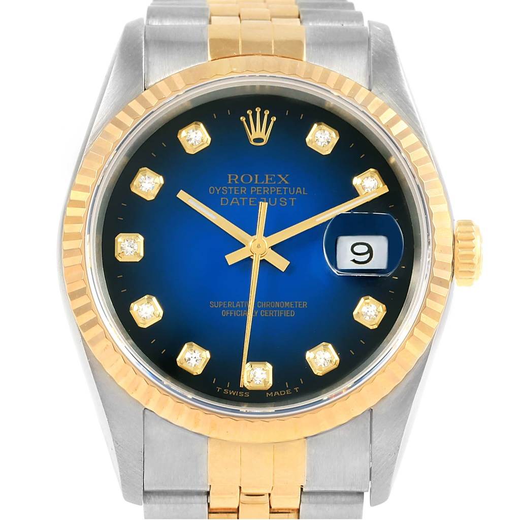 This image shows a frontal view of a Rolex Datejust 16233 Steel and Gold (two tone) Blue Dial 16233 Steel and Gold (two tone) Blue Dial watch, featuring a blue dial, gold hour markers, and a gold and silver bracelet.