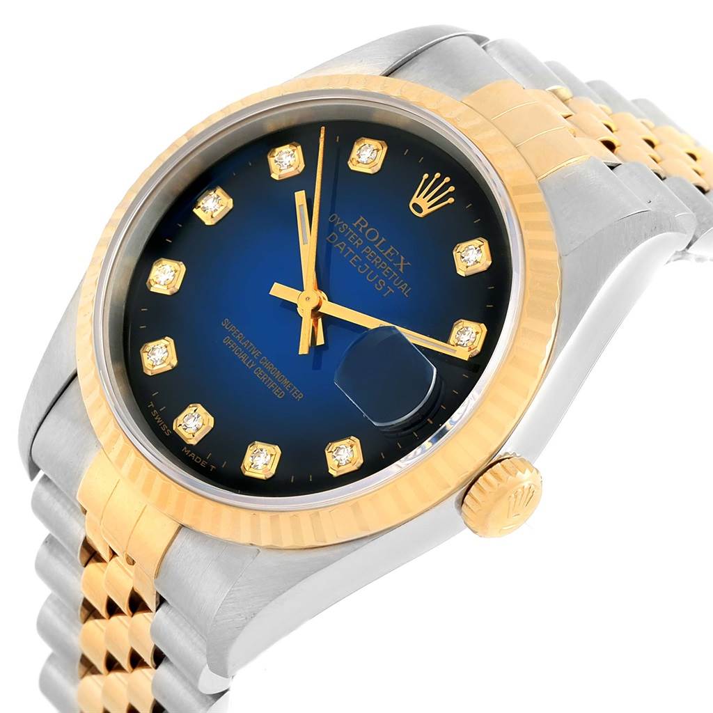 This image shows a Rolex Datejust 16233 Steel and Gold (two tone) Blue Dial 16233 Steel and Gold (two tone) Blue Dial watch at a slight angle, highlighting the blue dial, gold bezel, and Jubilee bracelet.