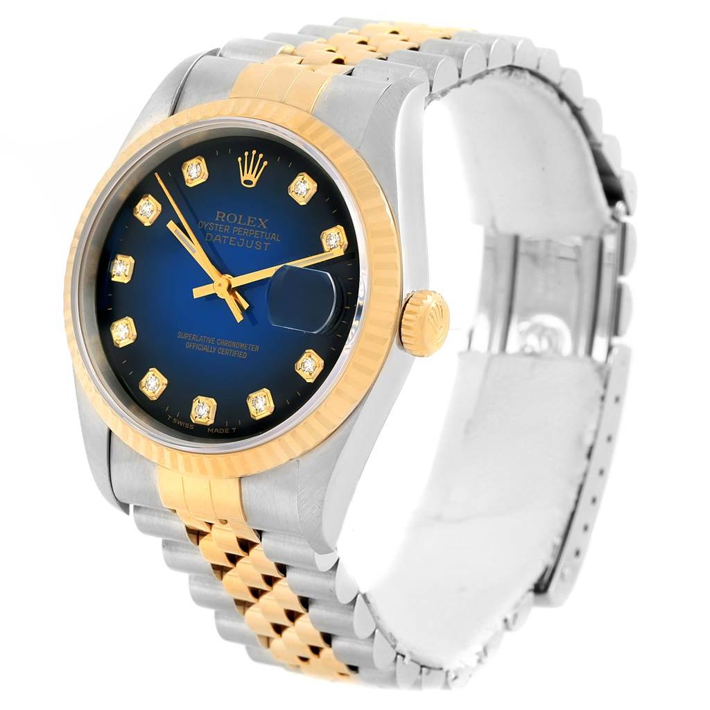 The image shows a side angle of the Rolex Datejust 16233 Steel and Gold (two tone) Blue Dial 16233 Steel and Gold (two tone) Blue Dial watch, highlighting its blue dial, two-tone bracelet, and diamond hour markers.
