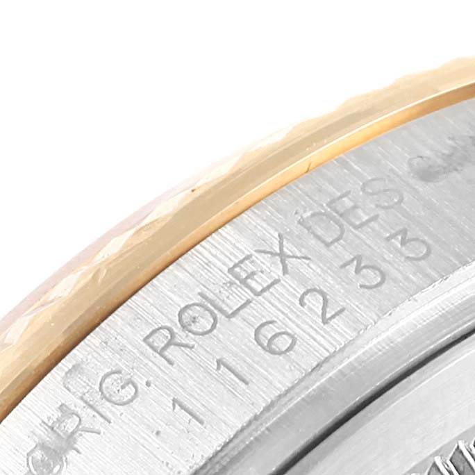 This image shows a close-up of the case back and serial number engraving on a Rolex Datejust 116233 Men's Stainless Steel Silver Dial 116233 Men's Stainless Steel Silver Dial watch.