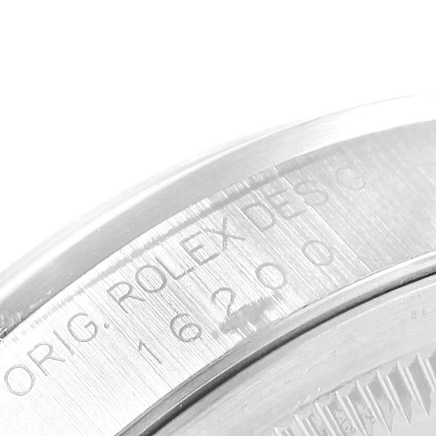 The image shows a close-up view of the bezel and case of a Rolex Datejust 16200 Men's Stainless Steel White Dial 16200 Men's Stainless Steel White Dial, revealing its engraved details.