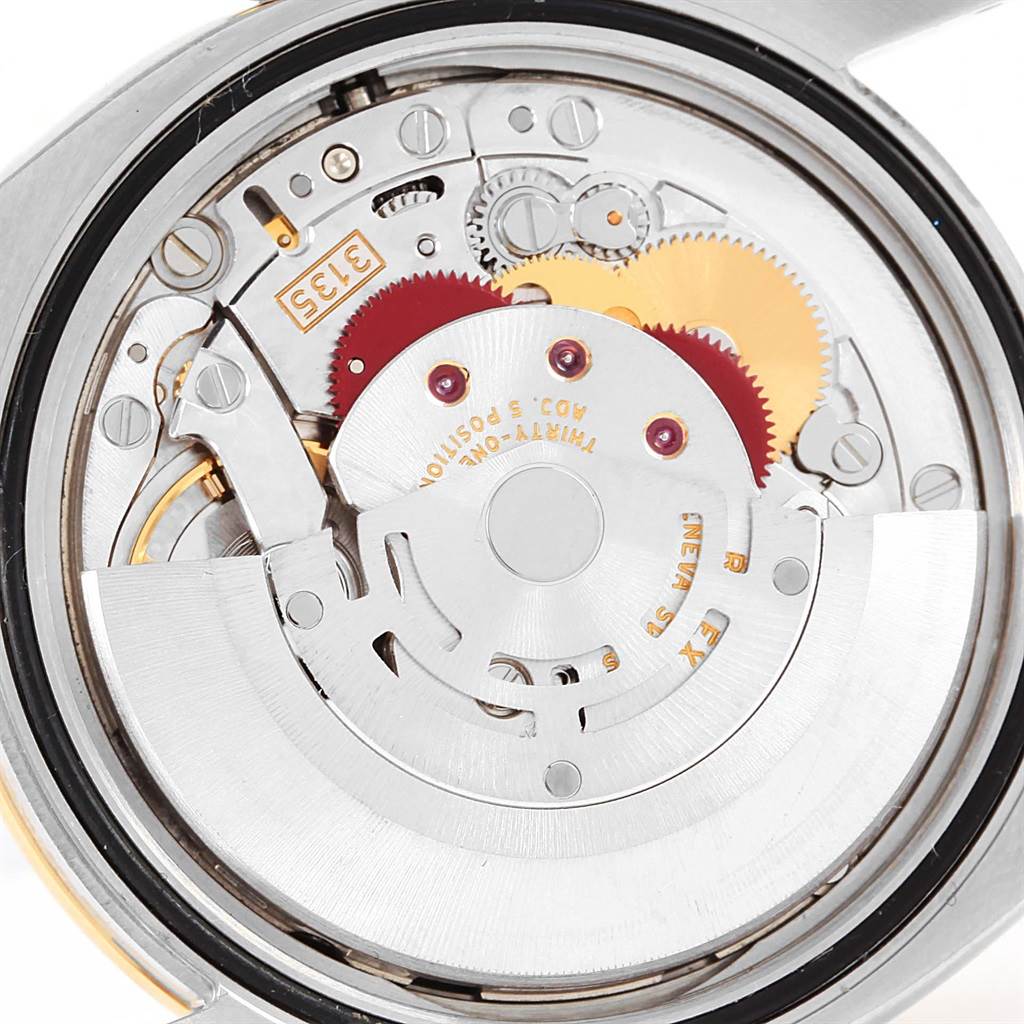 The image shows the internal mechanical movement of a Rolex Datejust 116243 Men
s Stainless Steel Black Dial 116243 Men
s Stainless Steel Black Dial watch from a top-down angle.