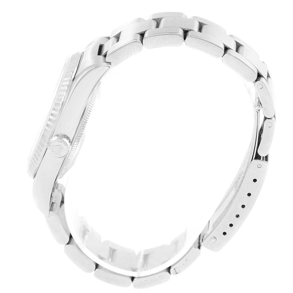 The image shows a side view of a Rolex Datejust 16234 Men's Stainless Steel Silver Dial 16234 Men's Stainless Steel Silver Dial watch, highlighting its bracelet, crown, and casing.