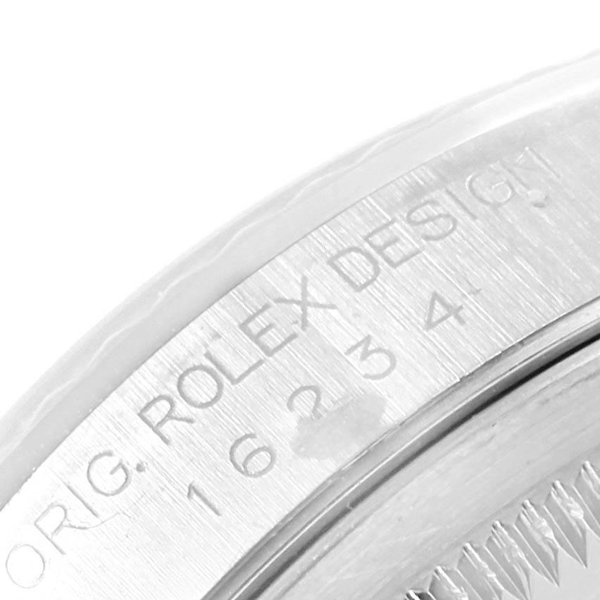 This image shows a close-up of the case back edge of a Rolex Datejust 16234 Men's Stainless Steel Silver Dial 16234 Men's Stainless Steel Silver Dial, including part of the model number engraving.