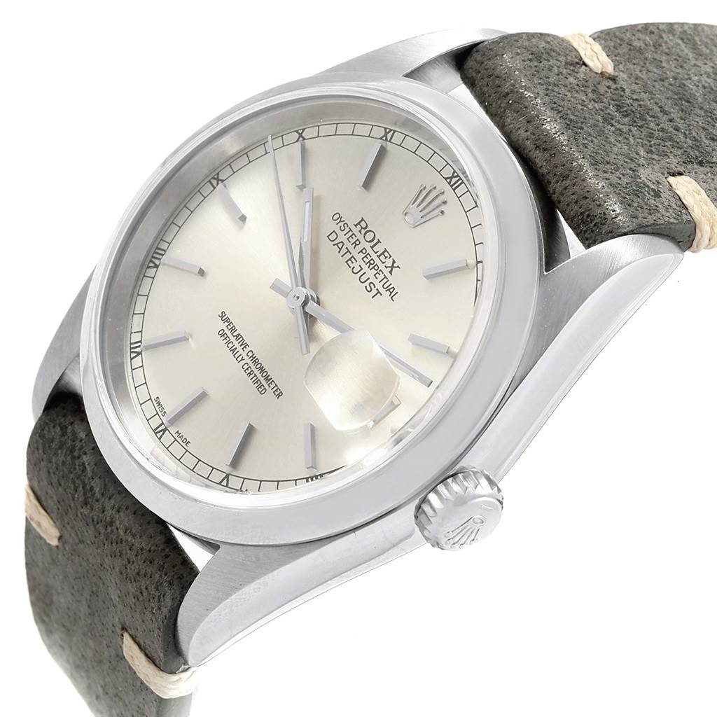 This image shows a Rolex Datejust 16200 Men's Stainless Steel Silver Dial 16200 Men's Stainless Steel Silver Dial watch at a slight side angle, highlighting the dial, crown, and leather strap.