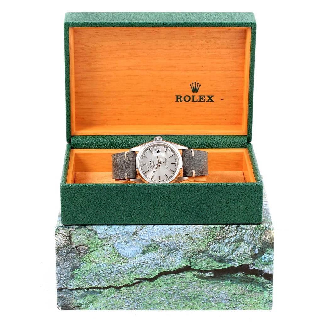 The Rolex Datejust 16200 Men's Stainless Steel Silver Dial 16200 Men's Stainless Steel Silver Dial watch is shown from the front, displayed in an open green and wood box.