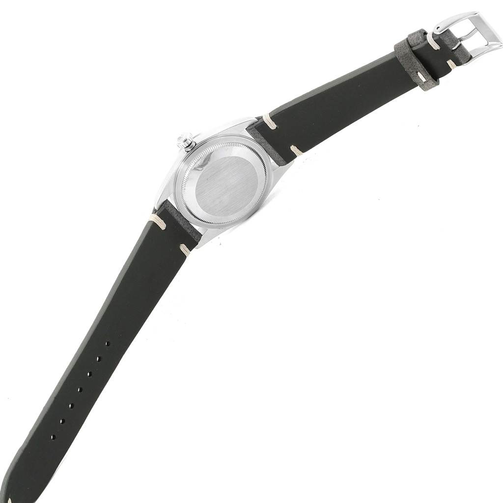 The image shows the underside of a Rolex Datejust 16200 Men's Stainless Steel Silver Dial 16200 Men's Stainless Steel Silver Dial watch with a black leather strap and buckle.