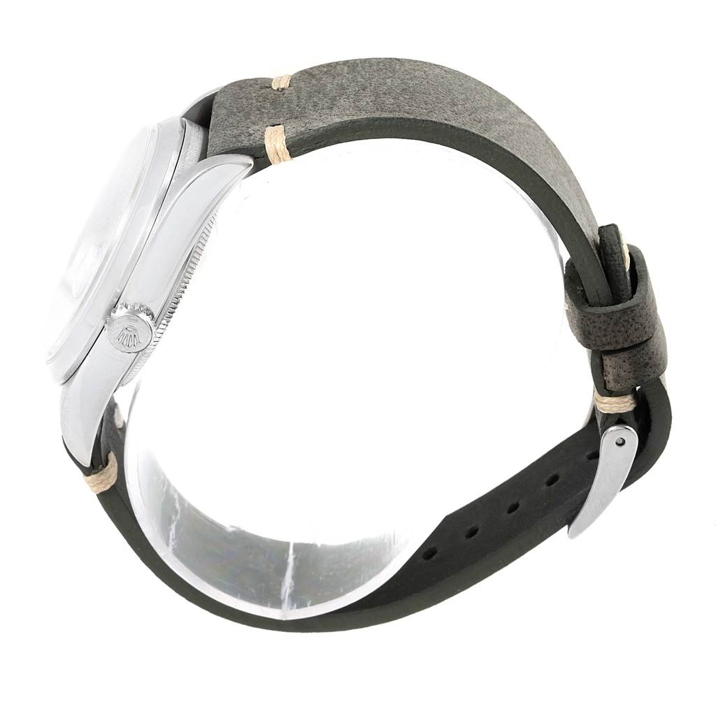 The image shows a side view of a Rolex Datejust 16200 Men's Stainless Steel Silver Dial 16200 Men's Stainless Steel Silver Dial watch with its leather strap and crown visible.