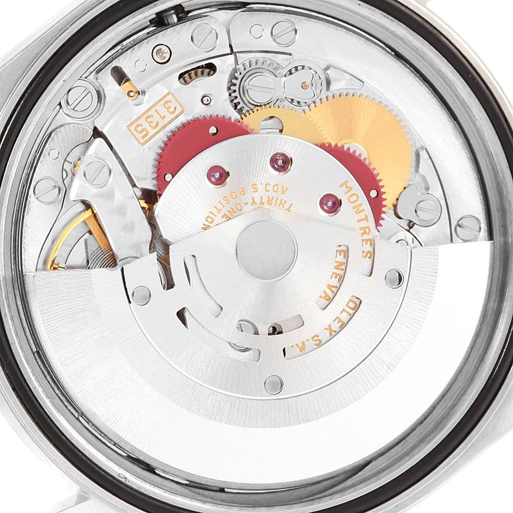 This close-up rear view of a Rolex Datejust 16200 Men's Stainless Steel Silver Dial 16200 Men's Stainless Steel Silver Dial watch showcases its intricate internal movement.