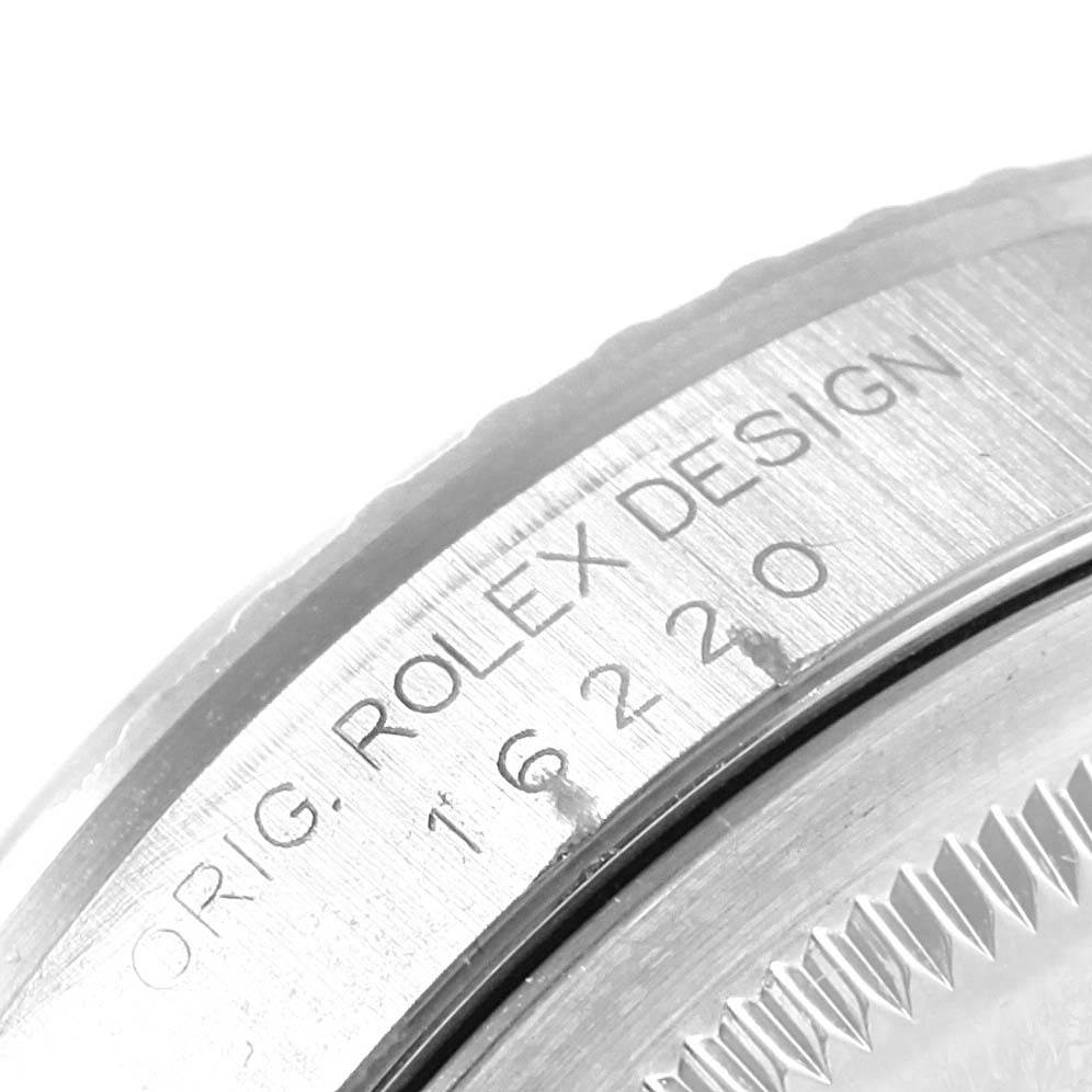 This image shows a close-up of the case back of a Rolex Datejust 16220 Men's Stainless Steel Silver Dial 16220 Men's Stainless Steel Silver Dial watch, displaying the model number and "ROLEX DESIGN" engraving.