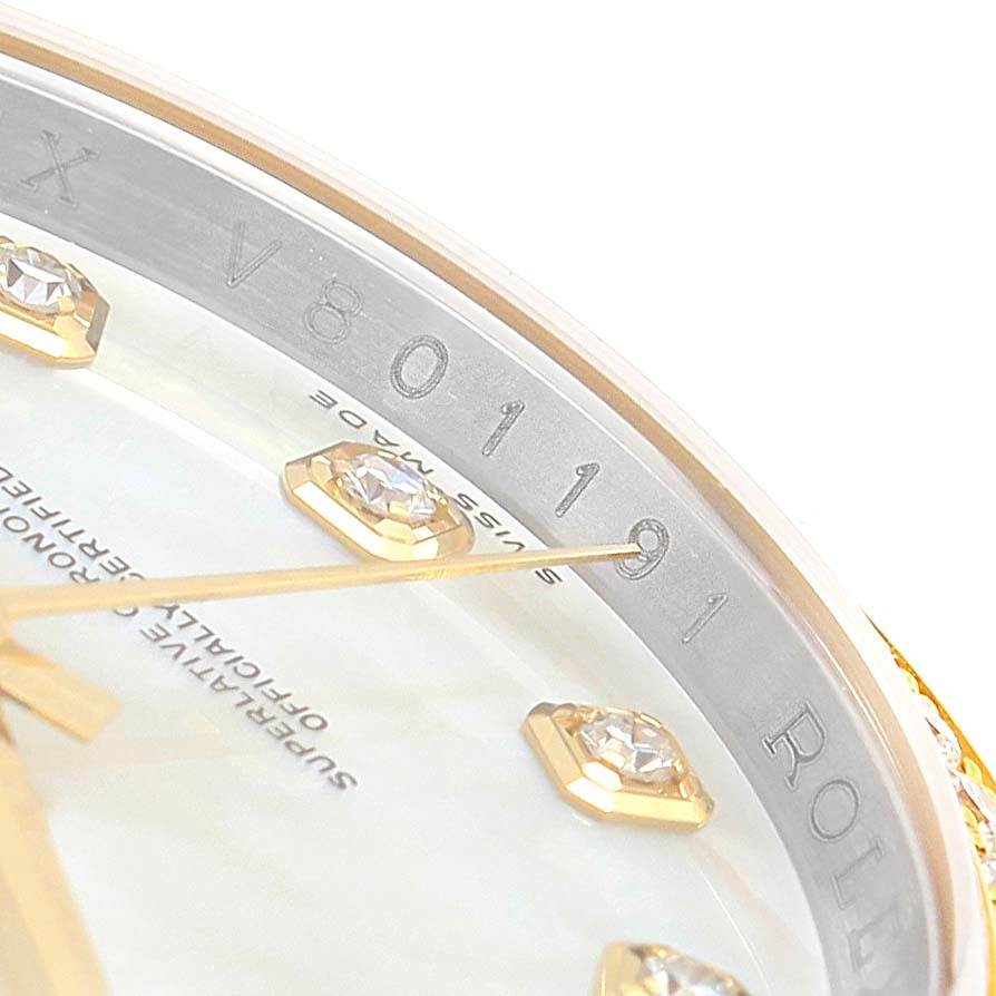 The image shows a close-up of the dial and the inner bezel with the serial number of a Rolex Datejust 116243 Stainless Steel Mother of Pearl Dial 116243 Stainless Steel Mother of Pearl Dial watch.