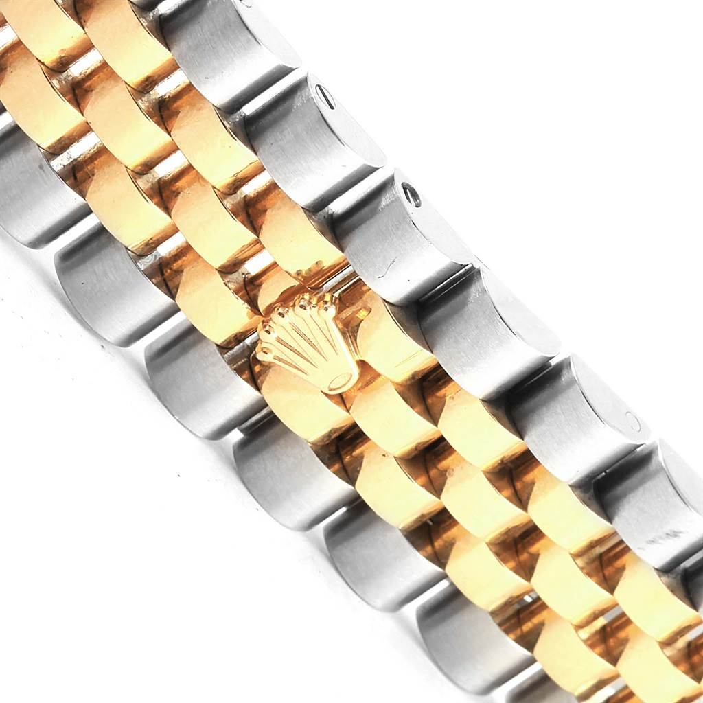 This image shows a close-up of the bracelet of a Rolex Datejust 116243 Stainless Steel Mother of Pearl Dial 116243 Stainless Steel Mother of Pearl Dial watch, highlighting the dual-tone metal links and the Rolex crown logo.