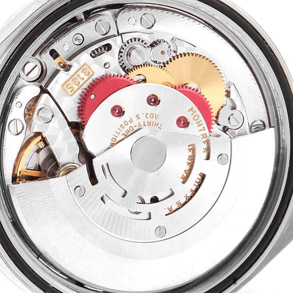 This image shows a close-up of the movement mechanism of a Rolex Datejust 16200 Men's Stainless Steel White Dial 16200 Men's Stainless Steel White Dial watch, highlighting its intricate gears and components.