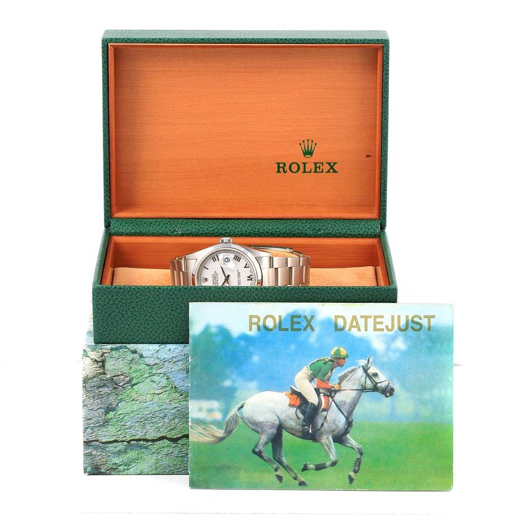 The image shows a Rolex Datejust 16200 Men's Stainless Steel White Dial 16200 Men's Stainless Steel White Dial watch displayed in an open box with its accessories, including a brochure in the foreground.