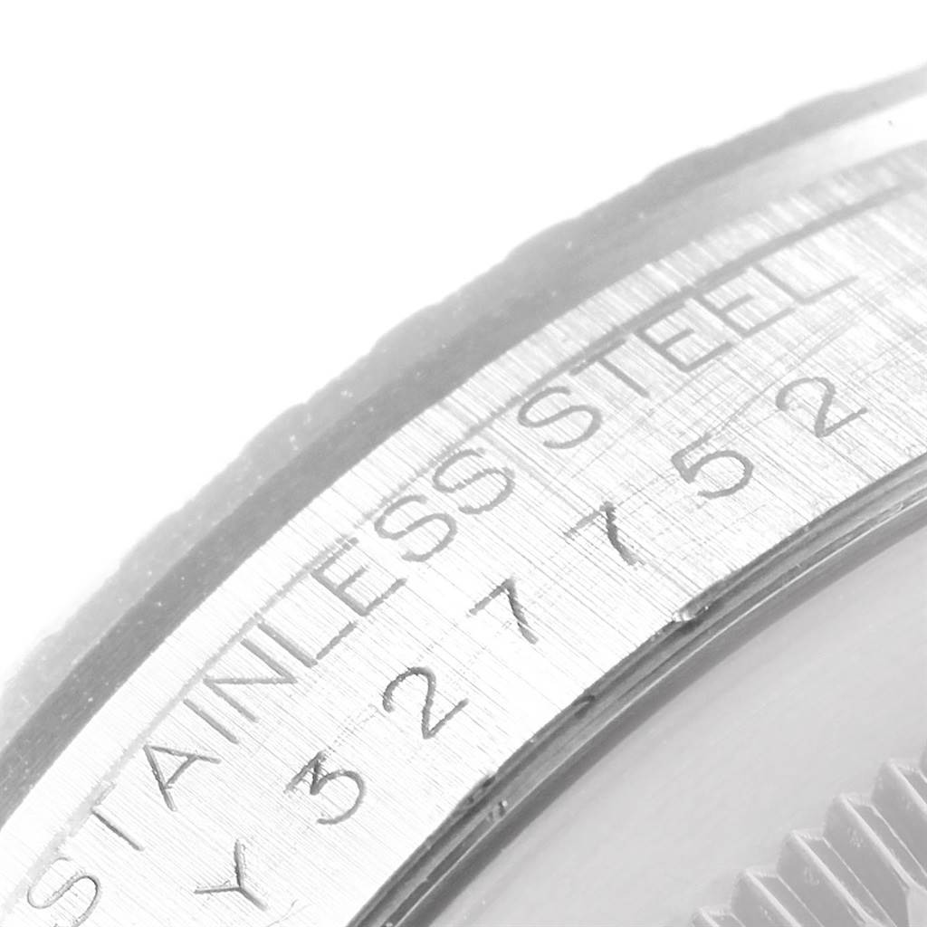 This image shows a close-up of the caseback edge and serial engraving of a Rolex Datejust 16220 Men's Stainless Steel Silver Dial 16220 Men's Stainless Steel Silver Dial watch.