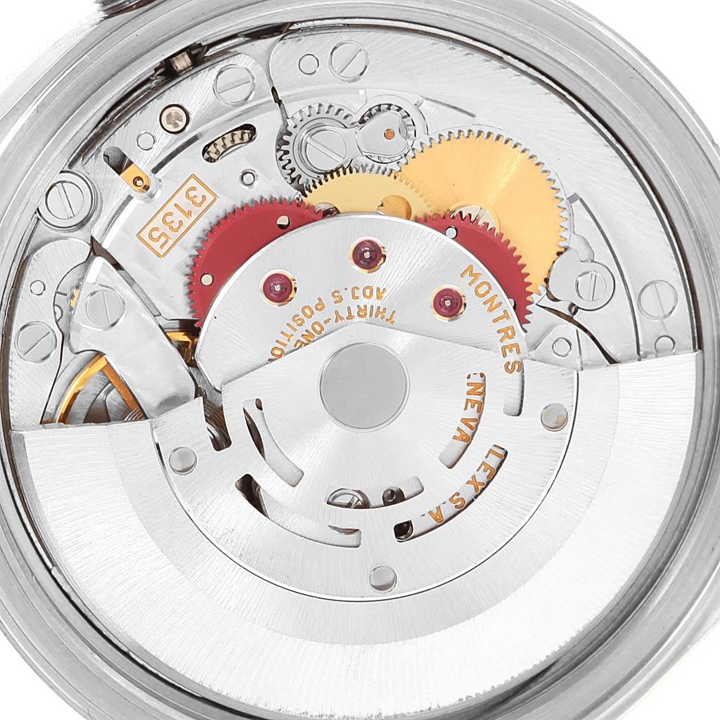 This image shows the internal mechanism and movement of a Rolex Datejust 16220 Men's Stainless Steel Silver Dial 16220 Men's Stainless Steel Silver Dial watch, including gears and the winding rotor.