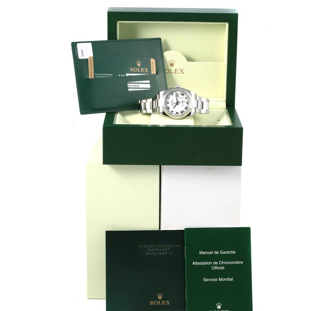 The Rolex Datejust 116200 Men's Stainless Steel White Dial 116200 Men's Stainless Steel White Dial watch is displayed front-on in its box with accompanying documentation and accessories.