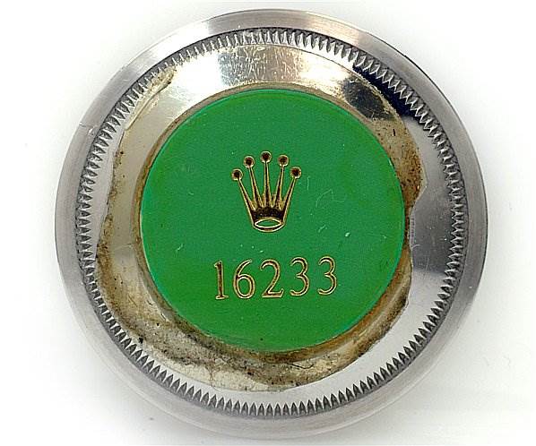 The image shows the back casing piece of a Rolex Datejust 16233 Men's Stainless Steel Black Dial 16233 Men's Stainless Steel Black Dial model, specifically model number 16233, viewed from above.