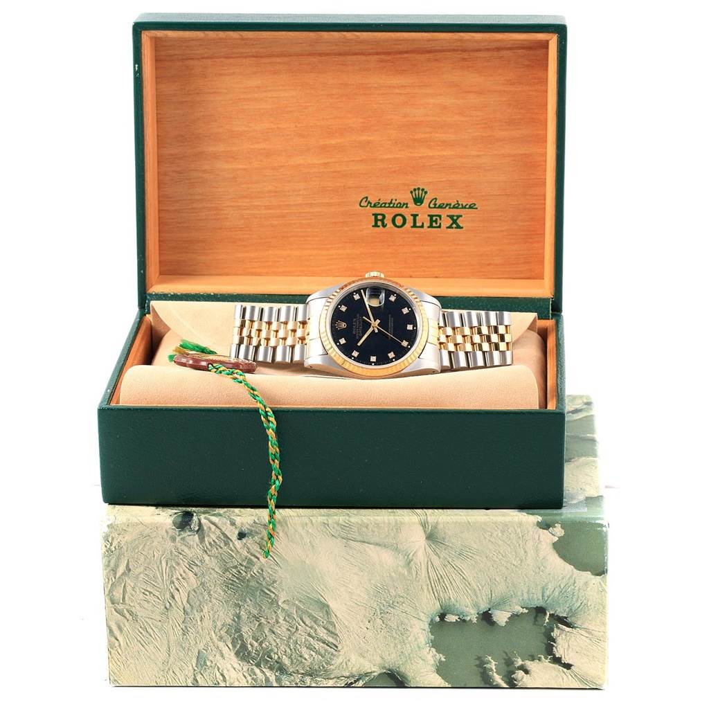 This image shows a Rolex Datejust 16233 Men's Steel and Gold (two tone) Black Dial 16233 Men's Steel and Gold (two tone) Black Dial watch from a front angle, displayed in its original green and wooden box.