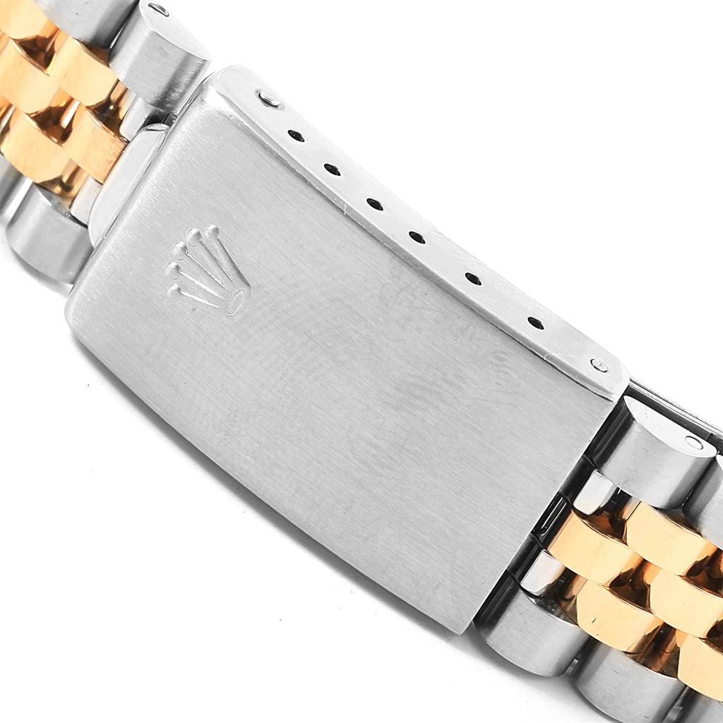 The image shows a close-up of the clasp and part of the bracelet of a Rolex Datejust 16233 Men's Steel and Gold (two tone) Black Dial 16233 Men's Steel and Gold (two tone) Black Dial watch.