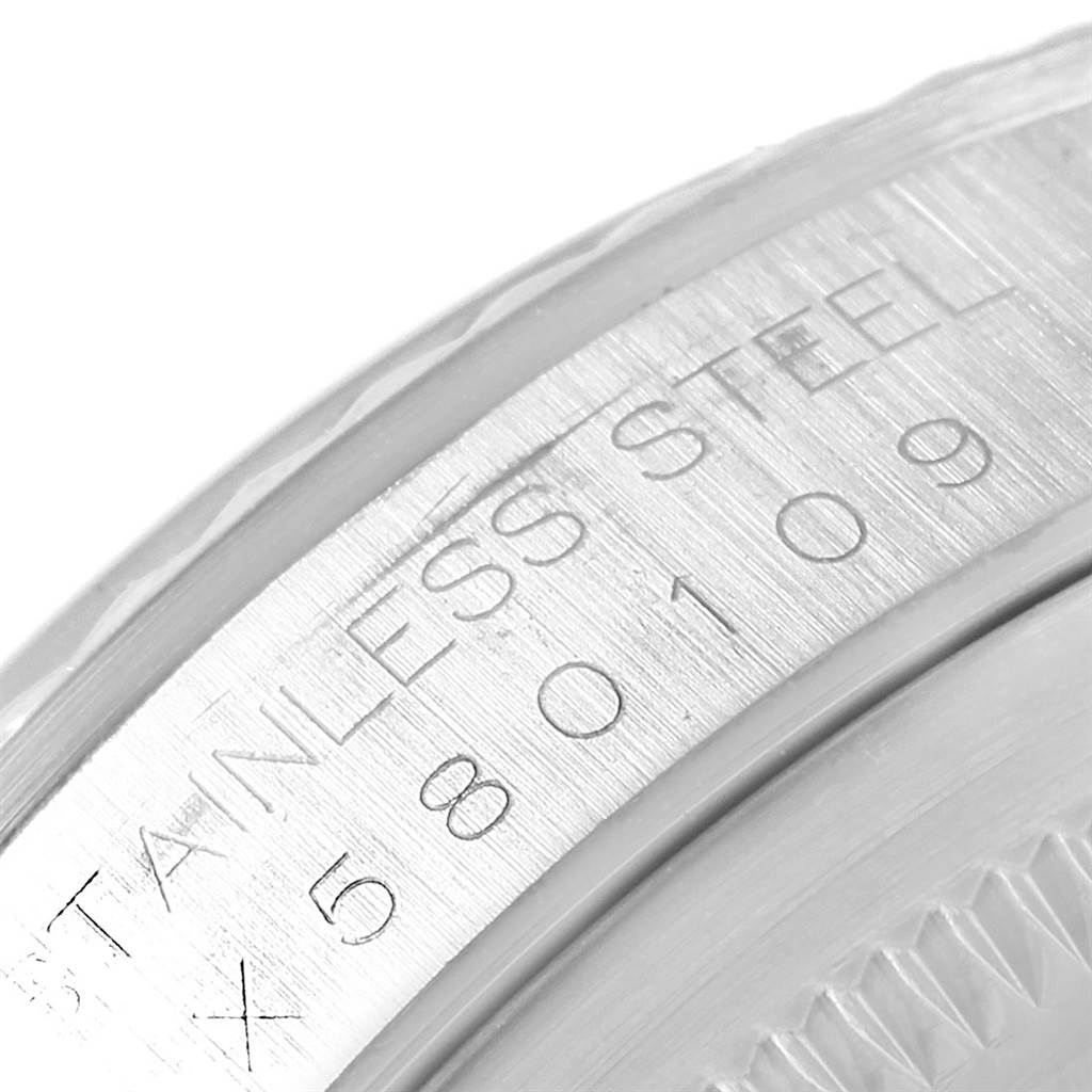 This is a close-up shot of the case side and engraving on a Rolex Datejust 16234 Men's Stainless Steel Silver Dial 16234 Men's Stainless Steel Silver Dial.