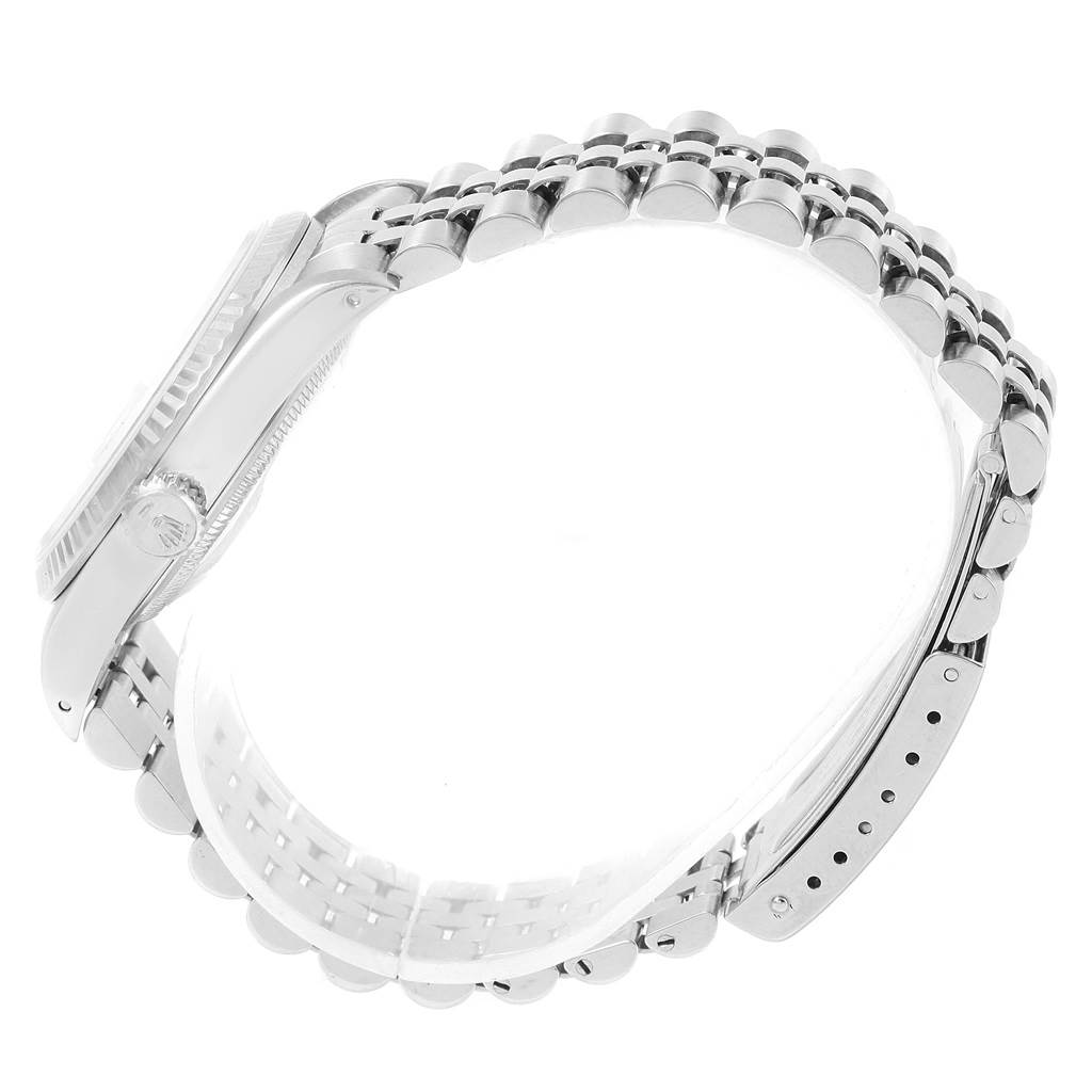 The image shows a side view of the Rolex Datejust 16234 Men's Stainless Steel Silver Dial 16234 Men's Stainless Steel Silver Dial watch with its crown, case, and metal bracelet visible.