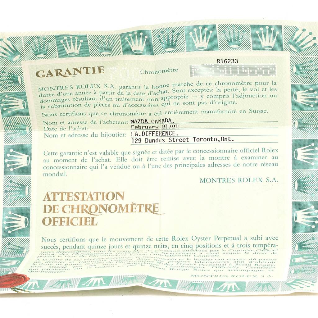 This image shows a warranty certificate for a Rolex Datejust 16233 Men's Steel and Gold (two tone) Champagne Dial 16233 Men's Steel and Gold (two tone) Champagne Dial watch model, R16233.