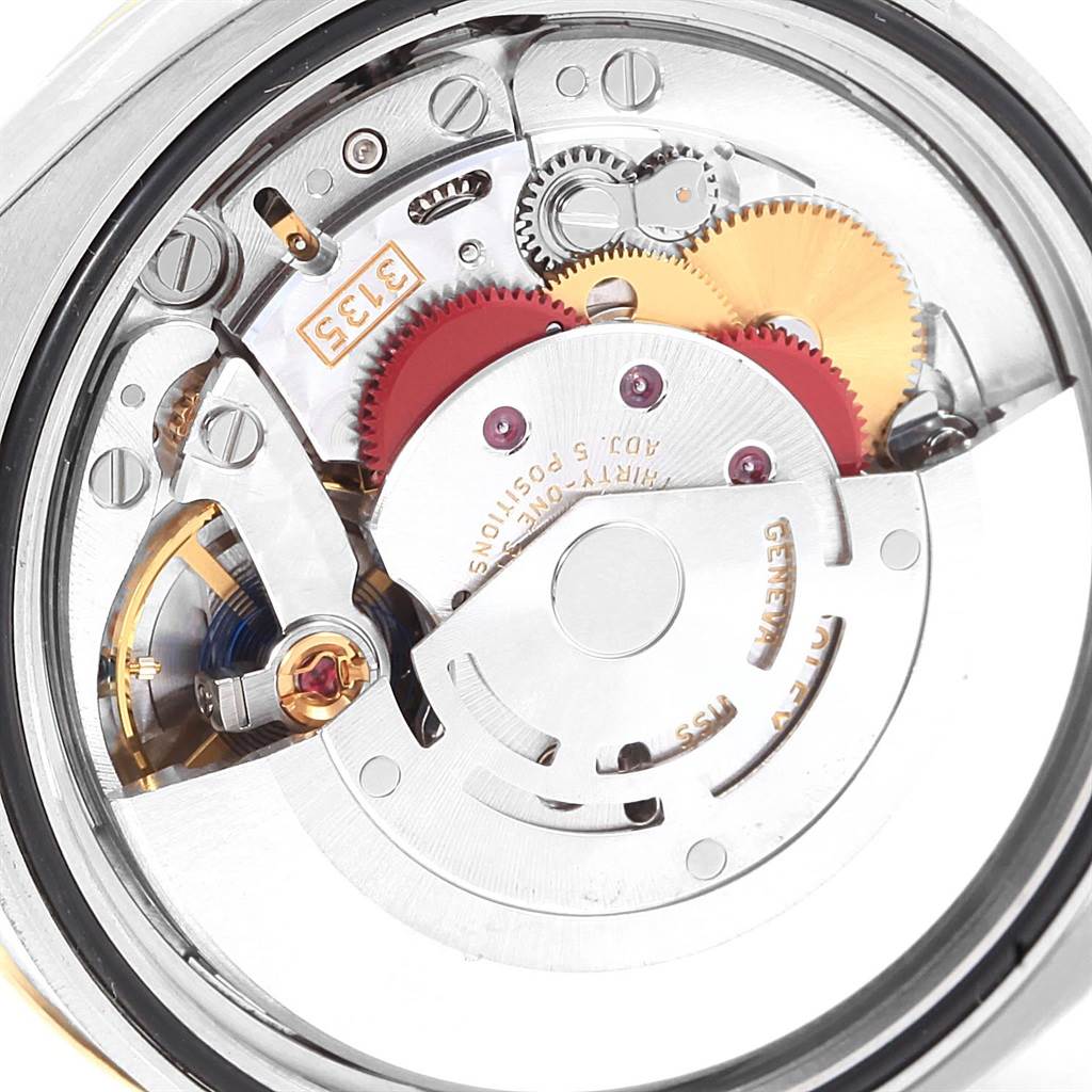 The image shows a close-up of the movement and inner mechanism of a Rolex Datejust 116243 Stainless Steel White Dial 116243 Stainless Steel White Dial watch.