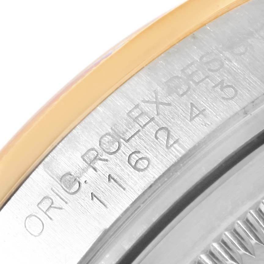 This close-up image shows the engraved side of the case of a Rolex Datejust 116243 Stainless Steel White Dial 116243 Stainless Steel White Dial watch, highlighting the model number.