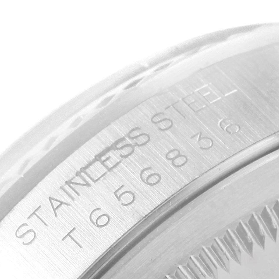 This close-up image shows the engraved stainless steel marking on the case of a Rolex Datejust 16234 Men's Stainless Steel White Dial 16234 Men's Stainless Steel White Dial watch.