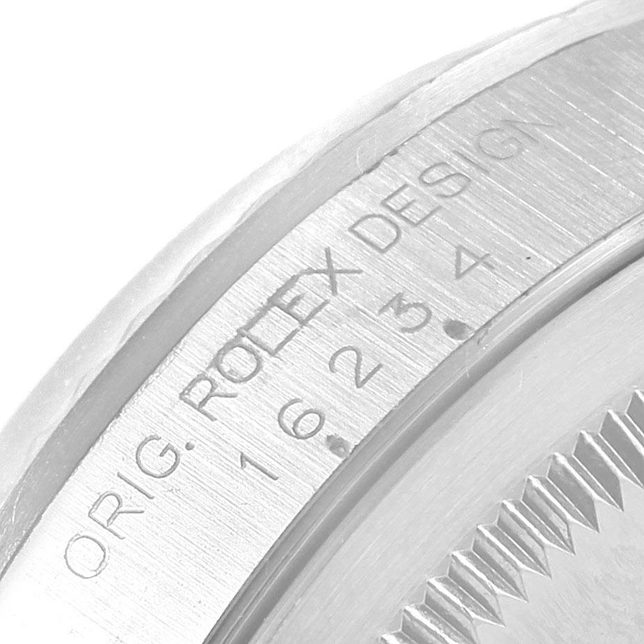 The image shows a close-up of the case back edge engraving of a Rolex Datejust 16234 Men's Stainless Steel White Dial 16234 Men's Stainless Steel White Dial watch.